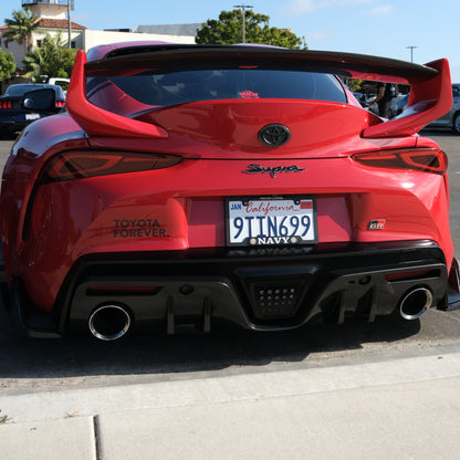 Black Toyota Forever Decal on rear bumper of a red A90 Toyota Supra