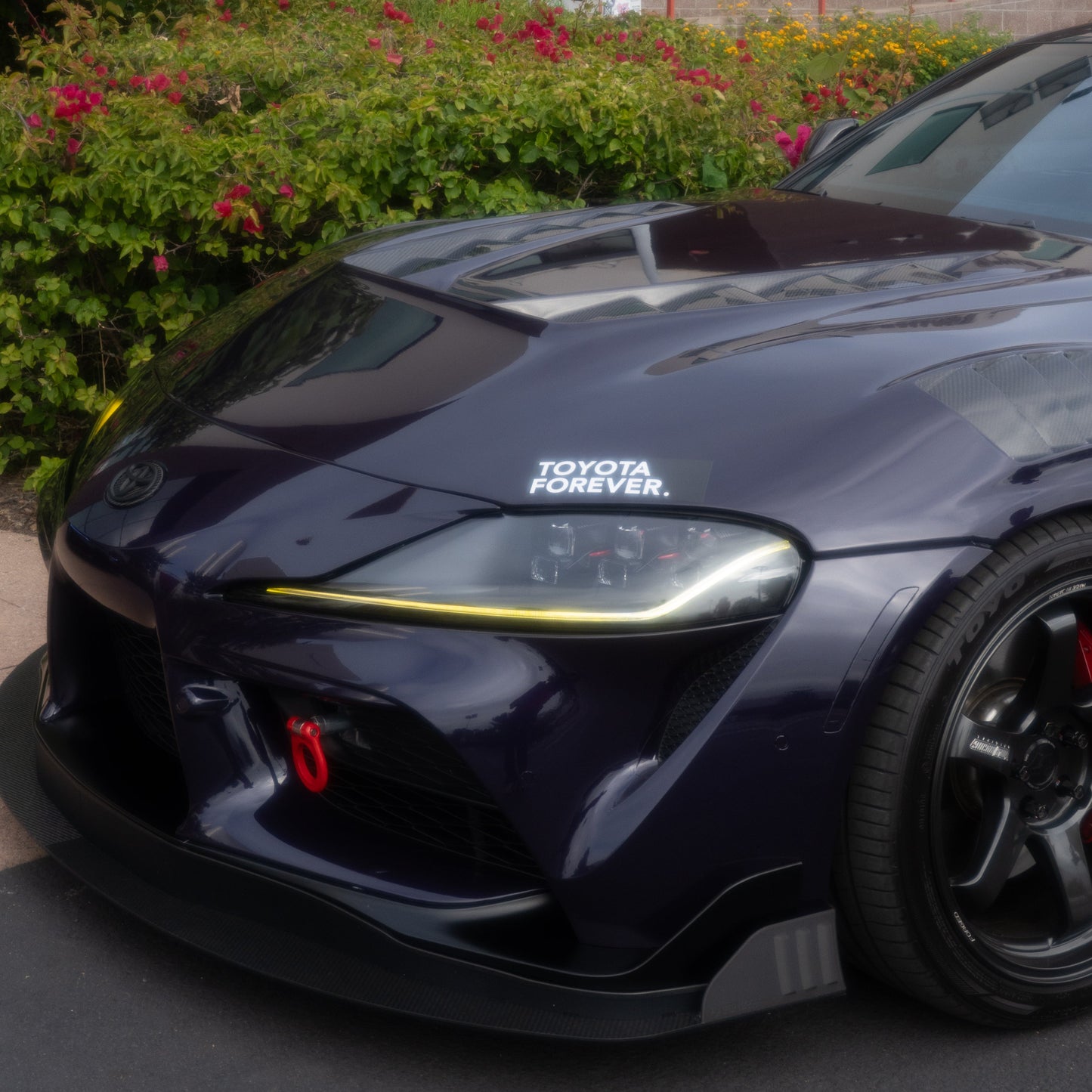 Toyota Forever Bumper Sticker on a nearly black dark blue A90 Toyota Supra
